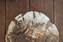  Bun Of Brown Rye Bread On Table