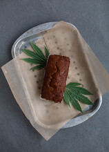 Freshly baked bread loaf with cannabis leaves