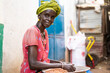 © Daniel Gonzalez/Stocksy - African woman at local market