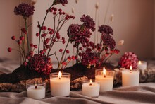 Red Flowers And Candles