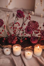 Dark Red Flowers And Burning Candles