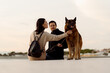 © Mauro Grigollo/Stocksy - Couple with their dog enjoying the free time