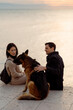 © Mauro Grigollo/Stocksy - Couple with their dog enjoying time together