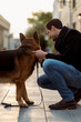 © Mauro Grigollo/Stocksy - Man with his dog at sunset