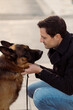 © Mauro Grigollo/Stocksy - Man looks at his dog
