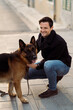 © Mauro Grigollo/Stocksy - Man with his dog on the street