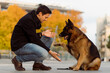 © Mauro Grigollo/Stocksy - Dog gives the paw to a man
