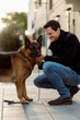 © Mauro Grigollo/Stocksy - Smiling man with his dog outdoor