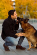 © Mauro Grigollo/Stocksy - Dog gives paw to his owner