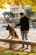 © Mauro Grigollo/Stocksy - Man walk the dog out in the city