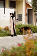 © Mauro Grigollo/Stocksy - Woman outdoor with her dog