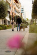 © Mauro Grigollo/Stocksy - Couple with a dog in urban area