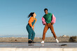 © Alba Vitta/Stocksy - Cool friends listening to music and dancing