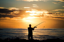 Fishing The Ocean At Sunrise 