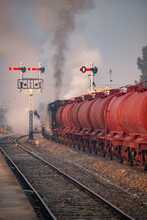 A Oil Freight Train Pulled By A Steam Locomotive.
