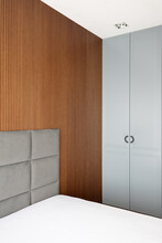 Wood Bedroom, A Grey Bed And Wardrobe With Two Doors