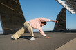 © Alba Vitta/Stocksy - Young trendy man dancing outdoors