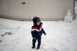 © Jelena Markovic/Stocksy - Toddler standing outdoor while snowing