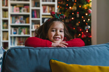 Little Girl On Sofa During Christmas Time