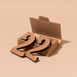 © Juan Moyano/Stocksy - cardboard number 22 out of a box