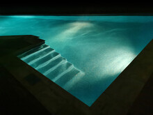 Turquoise Swimming Pool At Night