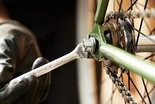 Bike Mechanic Repairs Bicycle