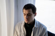 © Olga Kozicka/Stocksy - Man With Closed Eyes And AirPods In His Ears
