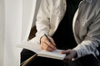 © Olga Kozicka/Stocksy - Writing In Journal