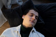 © Olga Kozicka/Stocksy - Man Resting With AirPods In His Ears