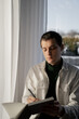 © Olga Kozicka/Stocksy - Man Writing In Journal With AirPods In His Ears