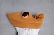 © Olga Kozicka/Stocksy - Pulling Sweater Over Head