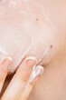 © Olga Kozicka/Stocksy - Applying Cream On Face