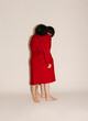 © Ulas&Merve/Stocksy - red coat