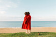 © Ulas&Merve/Stocksy - red coat