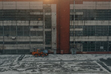 Orange Tractor On The Territory Of The Factory