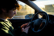 © Maite Pons/Stocksy - Teen driver texting while driving