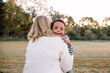 © Erin Drago/Stocksy - Mom Clapping With Young Son, Who Has Down Syndrome