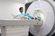 © Bisual Studio/Stocksy - Doctor doing MRI procedure in clinic
