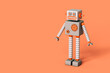 © Giada Canu/Stocksy - A cartoon robot on a pink background with copy space