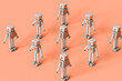 © Giada Canu/Stocksy - Toy robots in different positions on a pink background