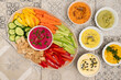 © Pixel Stories/Stocksy - Healthy food : colorful hummus bowls