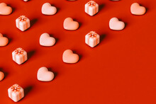 Hearts And Pink Presents On Red Background. 3d Render