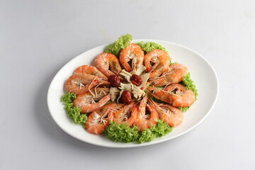 steamed fresh poached tiger prawn with vegetable lettuce on white plate background chinese banquet h