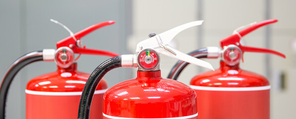 Fire extinguisher, Close-up red fire extinguishers tank in the building concepts of fire equipment for protection and prevent for emergency and safety rescue and alarm system training.