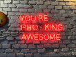 Neon sign that says you're pho-king awesome