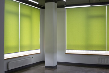 Leinwandbilder - Roller blinds closeup on the window in the interior. Roller shades for big windows. Automated curtains for office. Green color, monochrome material. Window coverings.
