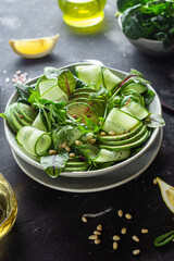 Wall Mural - Vegetarian salad with avocado, cucumber and herbs