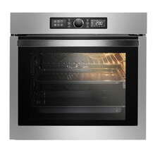 Built-In Fan Oven Isolated On White Background. Stainless Steel Body With Black Glass Transparent Doors And Light On Inside. Domestic Kitchen Appliances. Household Equipment. Front View.