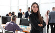 © ASDF - confident young business woman on the background of the office