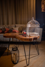 Bird Cage On Saloon Table With Dramatic Light 